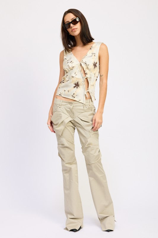 Emory Park beige floral tie front sleeveless top with beige cargo pants and sunglasses on model