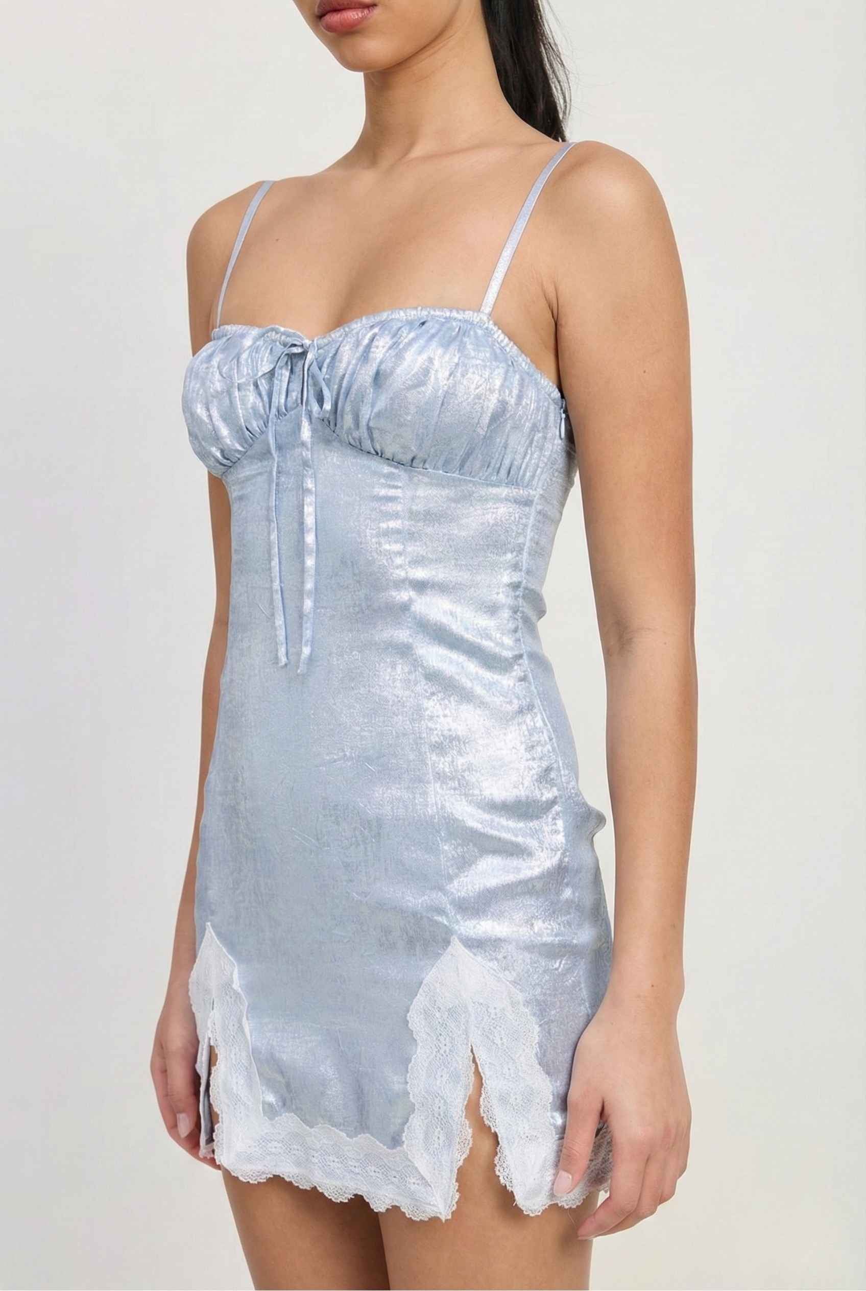 Esme Mini Light Blue Satin Lace Hem Dress with lace hem on a plain background