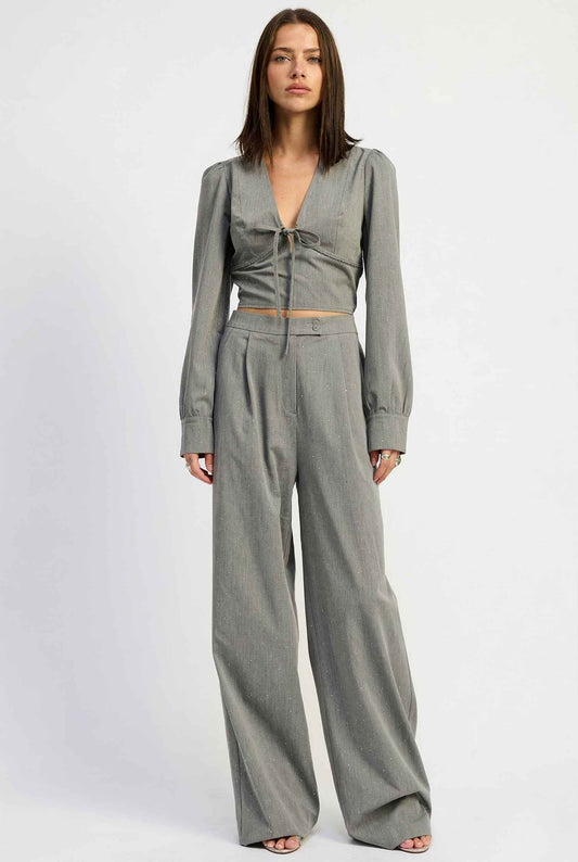 Woman wearing a Freya Top Grey Rhinestone Embellished V-Neck Cropped Blouse.