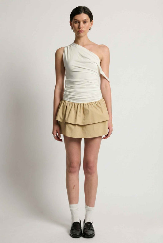 Woman wearing a Hadley Mini Ivory Ruched One-Shoulder Mixed Media Dress on a plain background