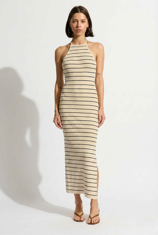 Woman wearing a Inez Midi Ivory Stripe Halter Knit Dress on a white background