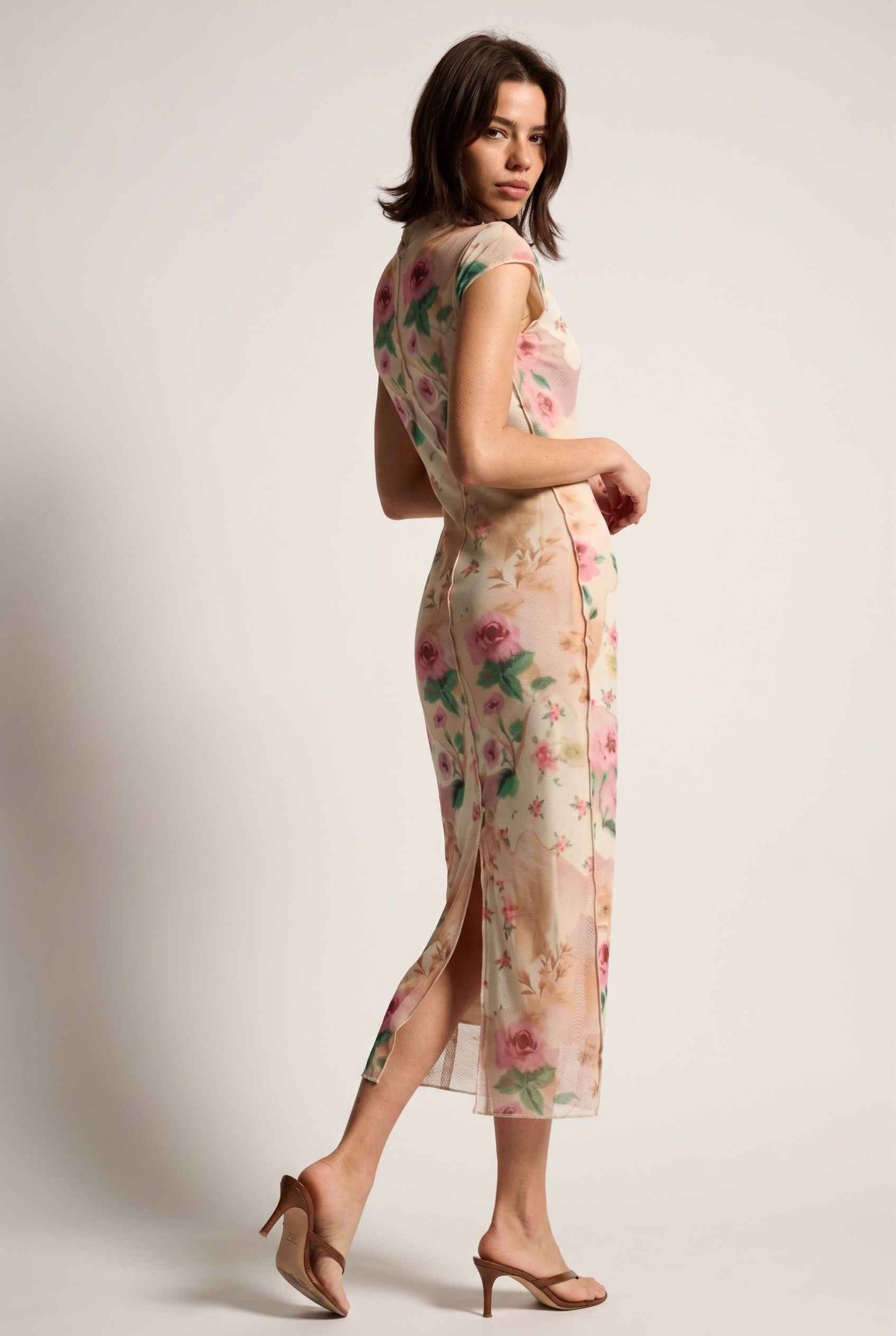 Model wearing Isabella Floral Mesh Midi Dress in Rose Floral Cap Sleeve Column Dress paired with heeled sandals