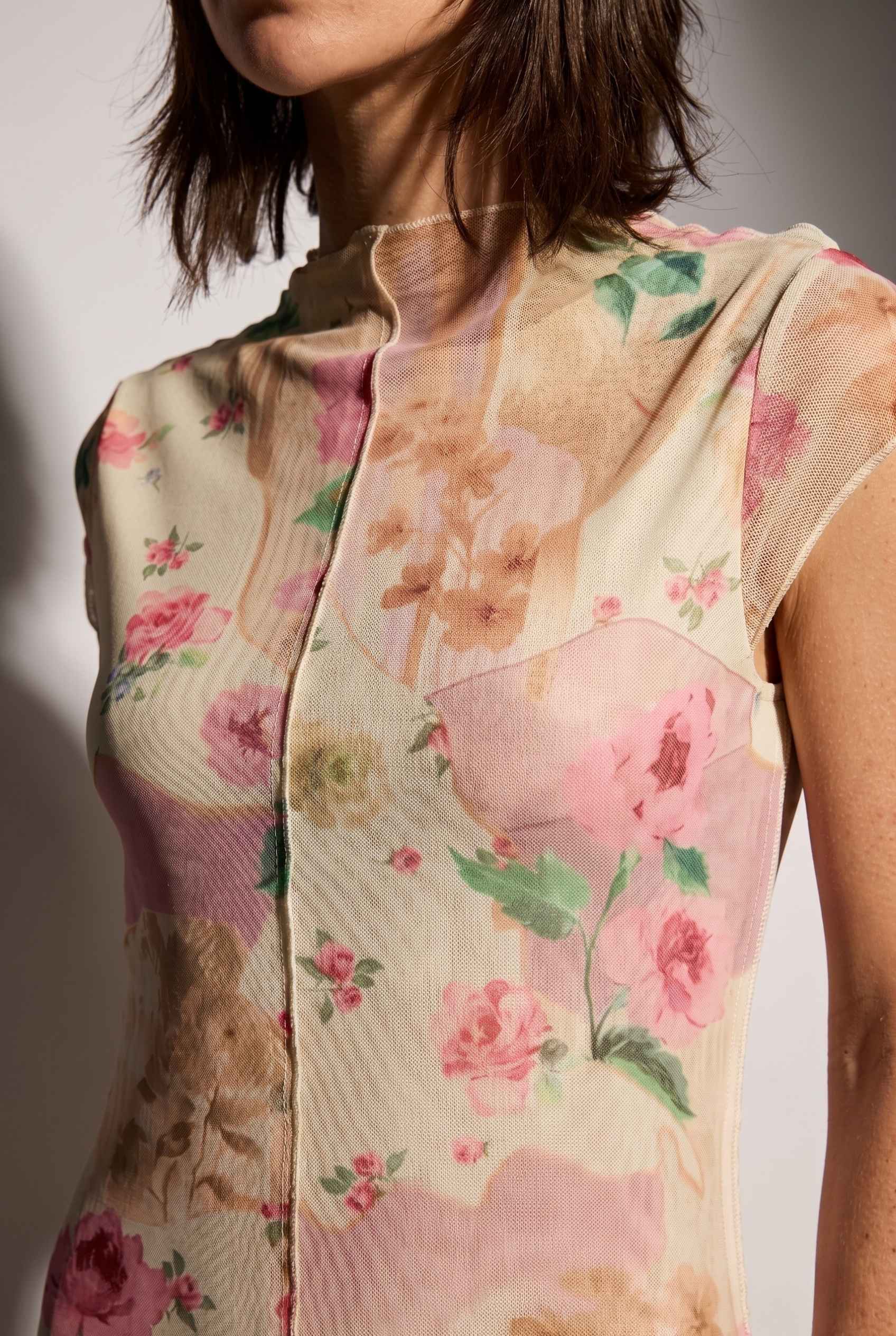 Model wearing Isabella Floral Mesh Midi Dress in Rose Floral Cap Sleeve Column Dress close up unique pattern