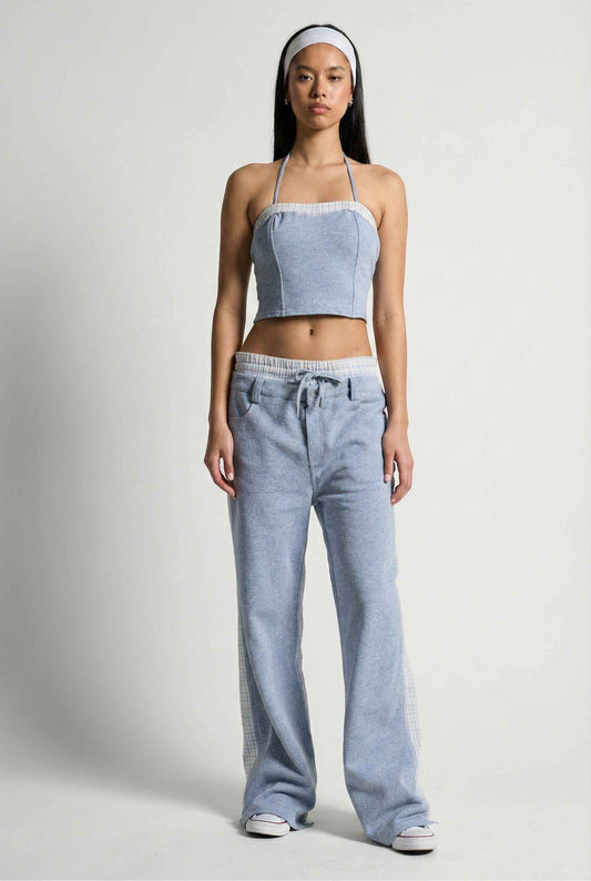 Model wearing Jamie Pants in Blue Double-Waist Boxer Style Trousers with matching halter top and sneakers against plain backdrop