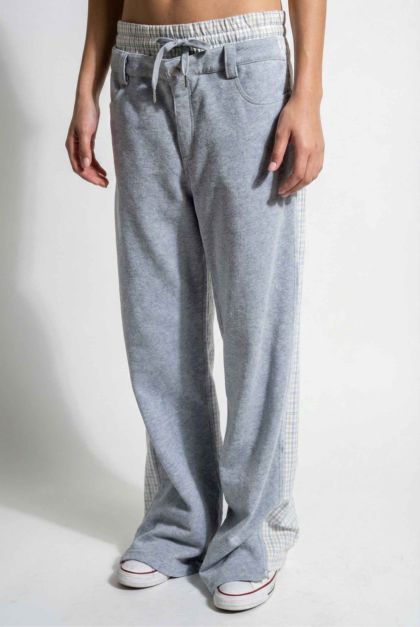 Model wearing Jamie Pants in Blue Double-Waist Boxer Style Trousers with matching halter top and sneakers against plain backdrop