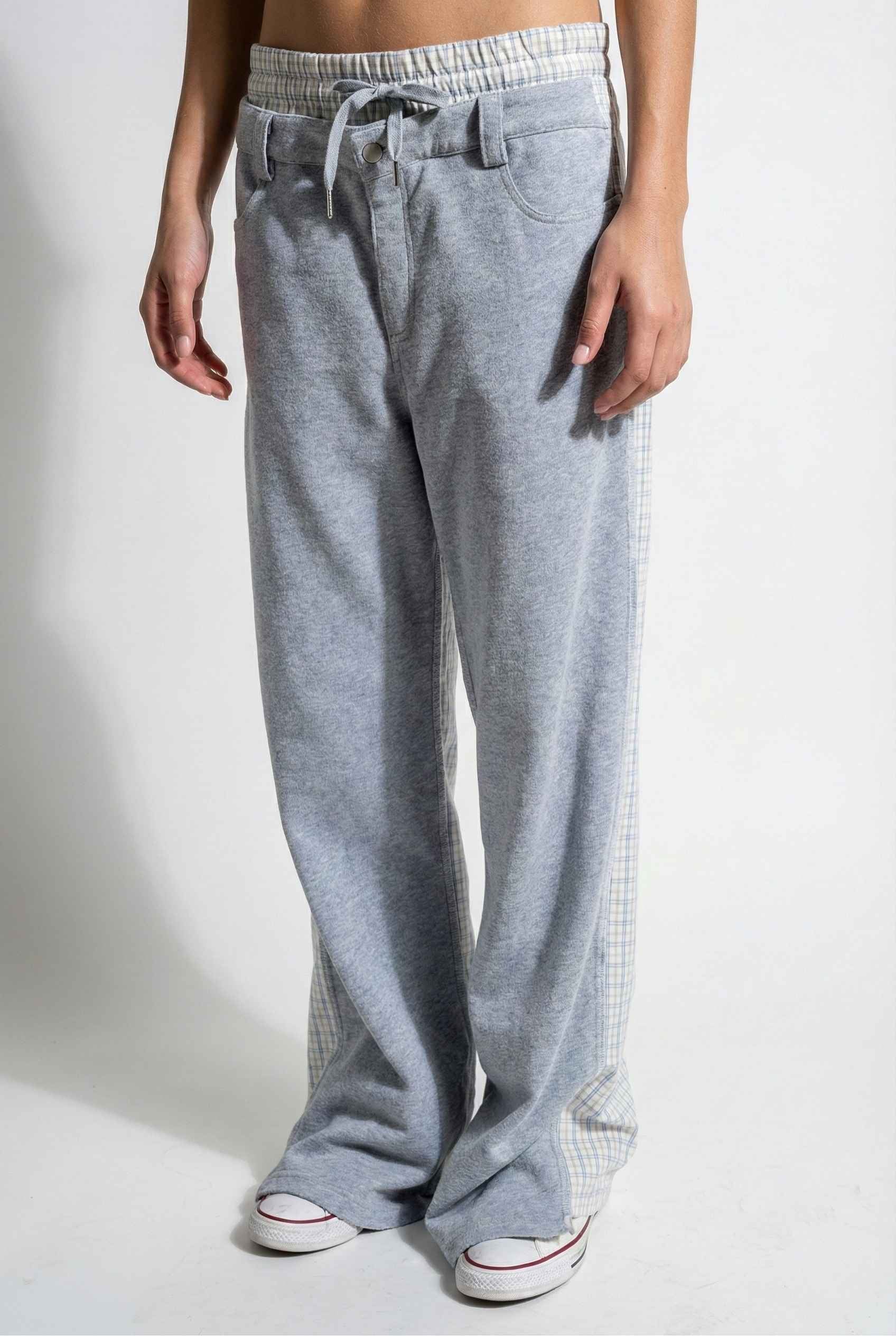 Model wearing Jamie Pants in Blue Double-Waist Boxer Style Trousers with matching halter top and sneakers against plain backdrop