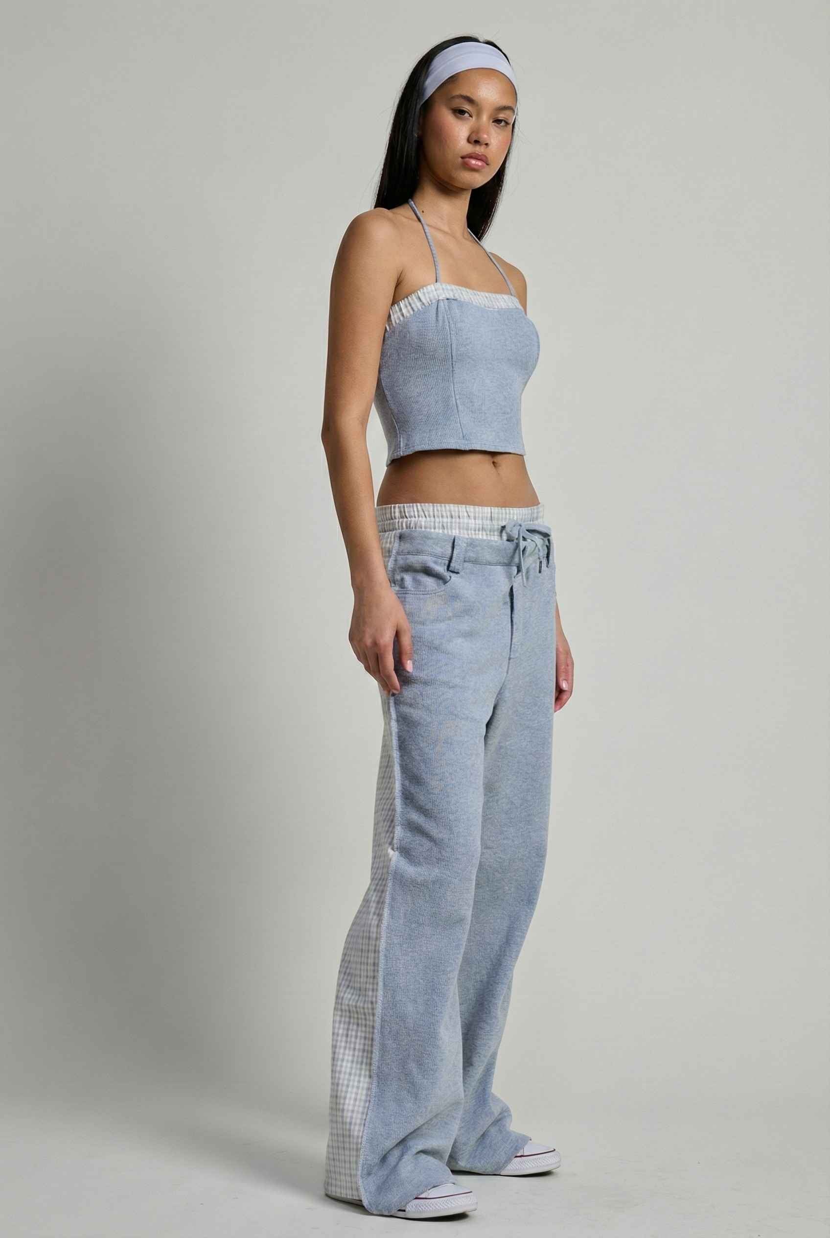 Model wearing Jamie Pants in Blue Double-Waist Boxer Style Trousers with matching halter top and sneakers against plain backdrop