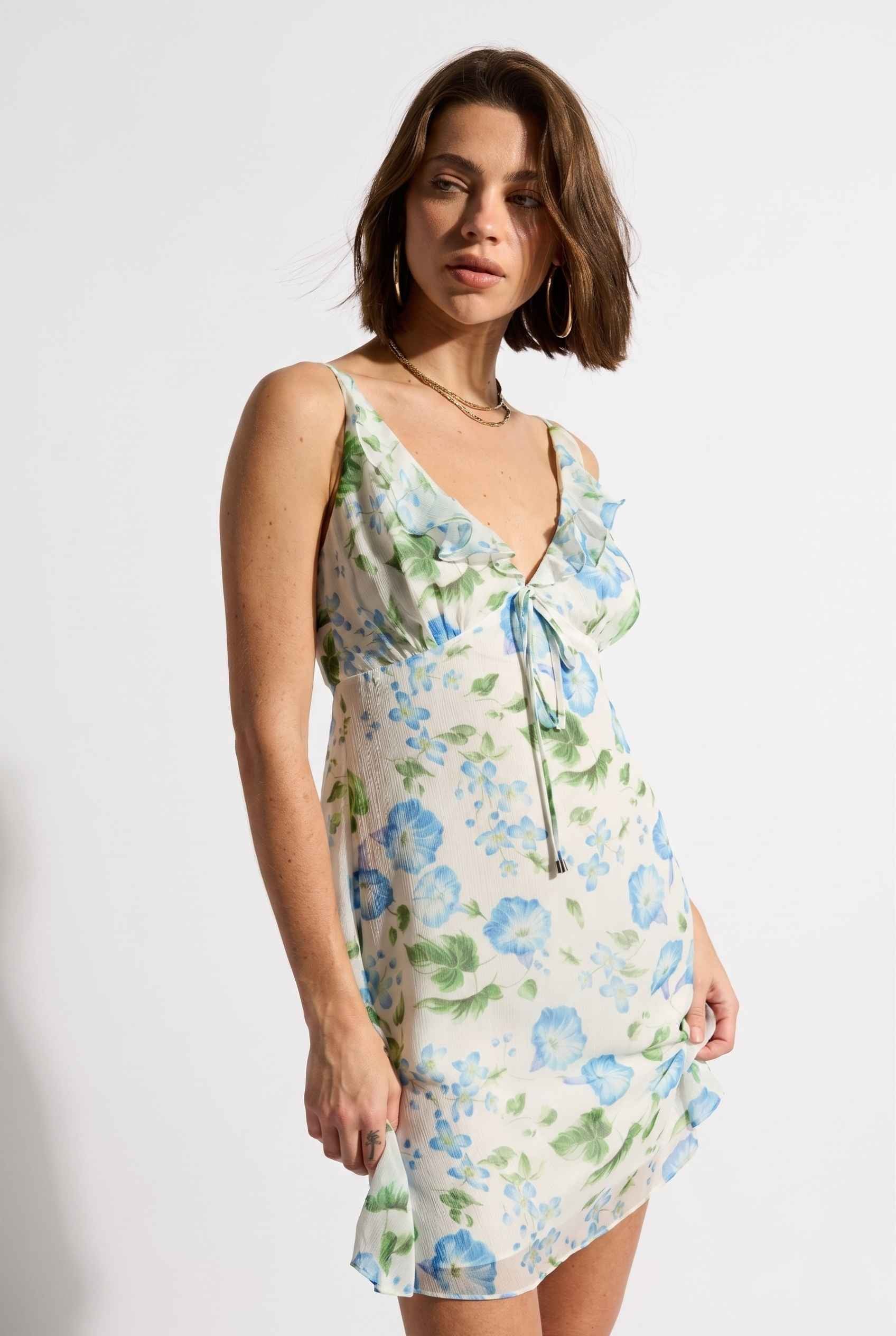 Model wearing Julia V-Neck Ruffle Floral Mini Dress Chiffon Slip Dress in Blue 