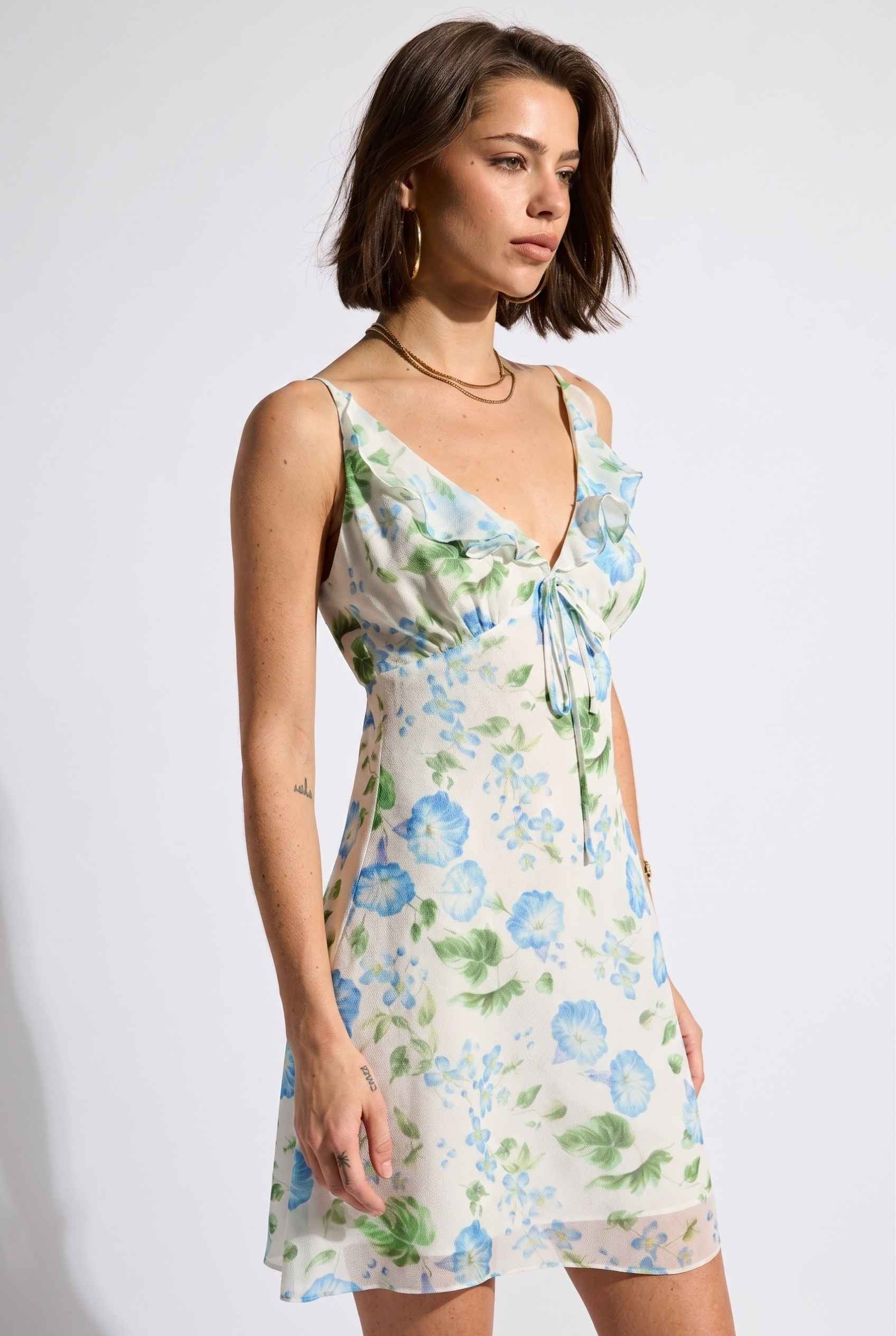 Model wearing Julia V-Neck Ruffle Floral Mini Dress Chiffon Slip Dress in Blue 