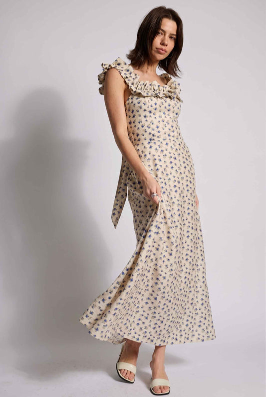 Model wearing Juliette Floral Maxi Dress in Blue Floral Ruffle Neck A-Line Dress with heeled sandals