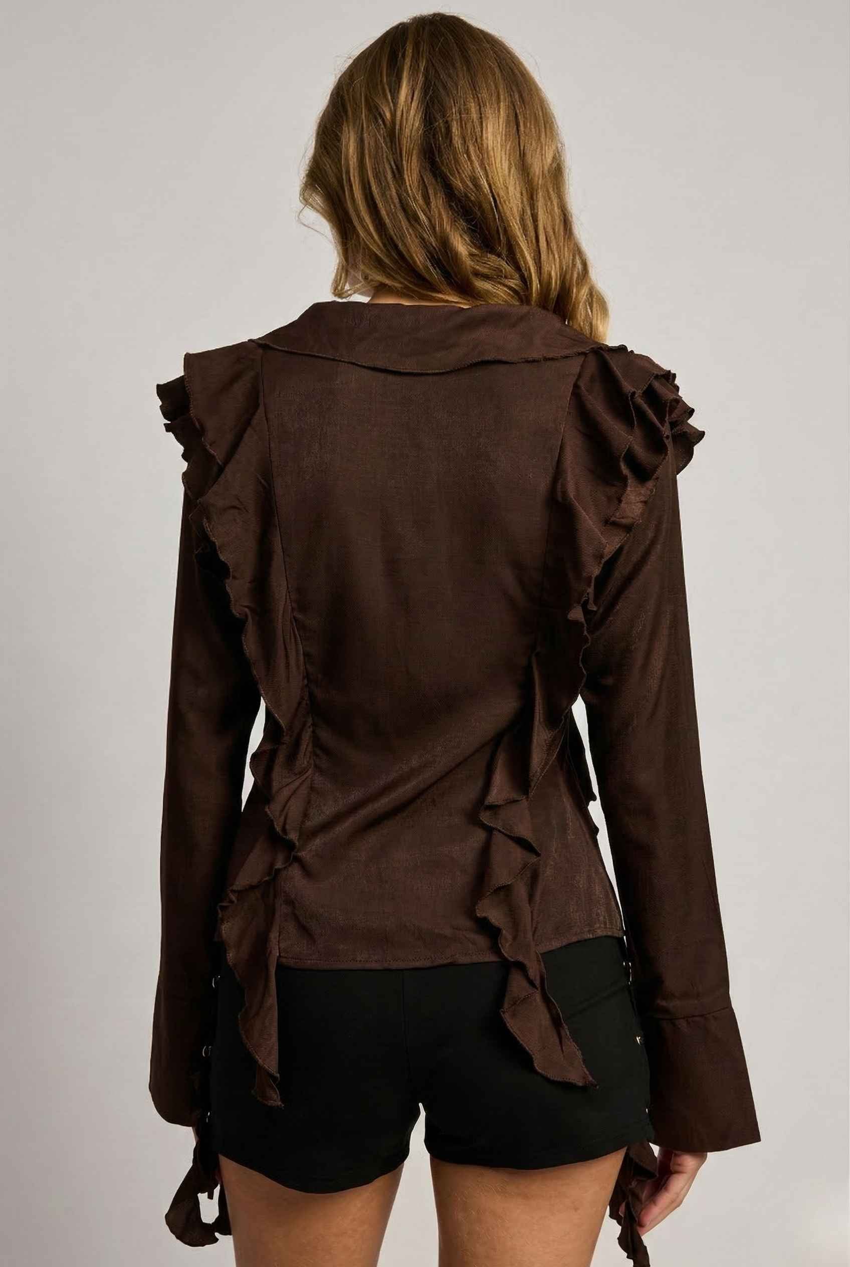 Kaia Top Chocolate Brown Ruffle Tie-Front Long Sleeve Blouse worn by a woman on a plain background