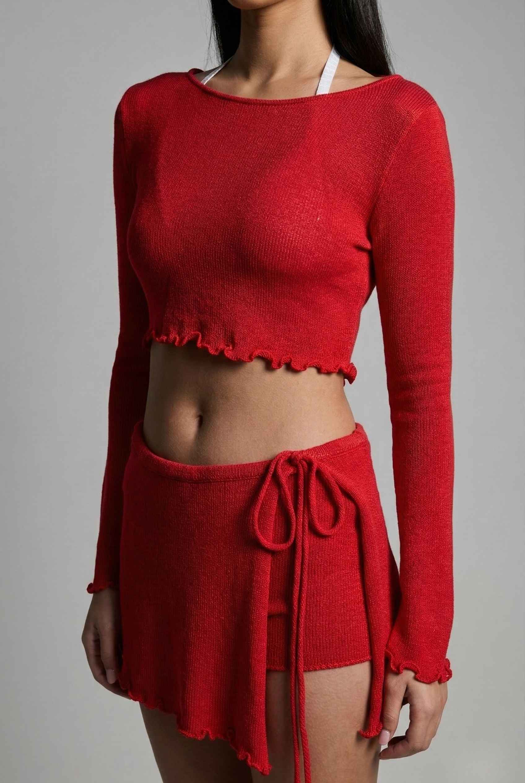 Kaia Top Red Sheer Knit Boat Neck Long Sleeve Crop and skirt set on a gray background