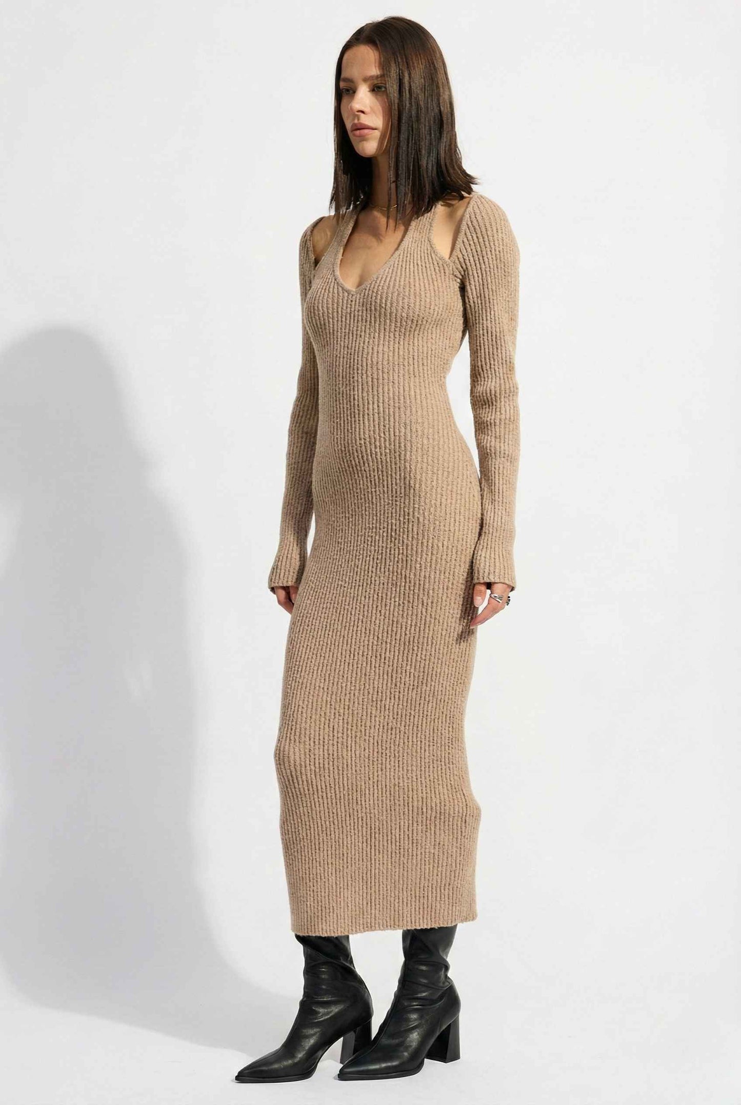 Woman wearing a Keaton Midi Mocha Cutout Shoulder Ribbed Knit Dress with cut-out shoulders on a white background
