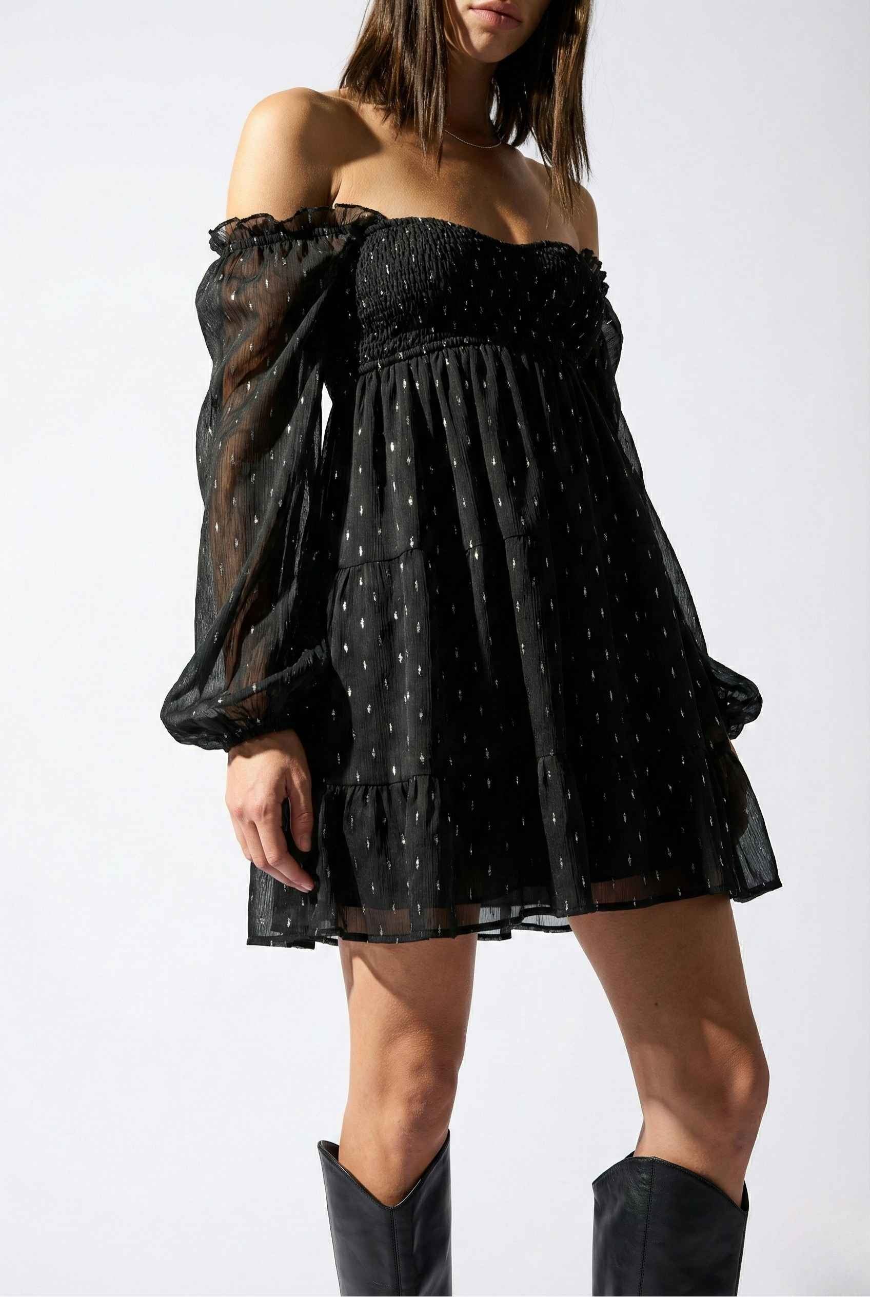 Lyra Mini Black Smocked Long Sleeve Dress with sheer sleeves on a white background