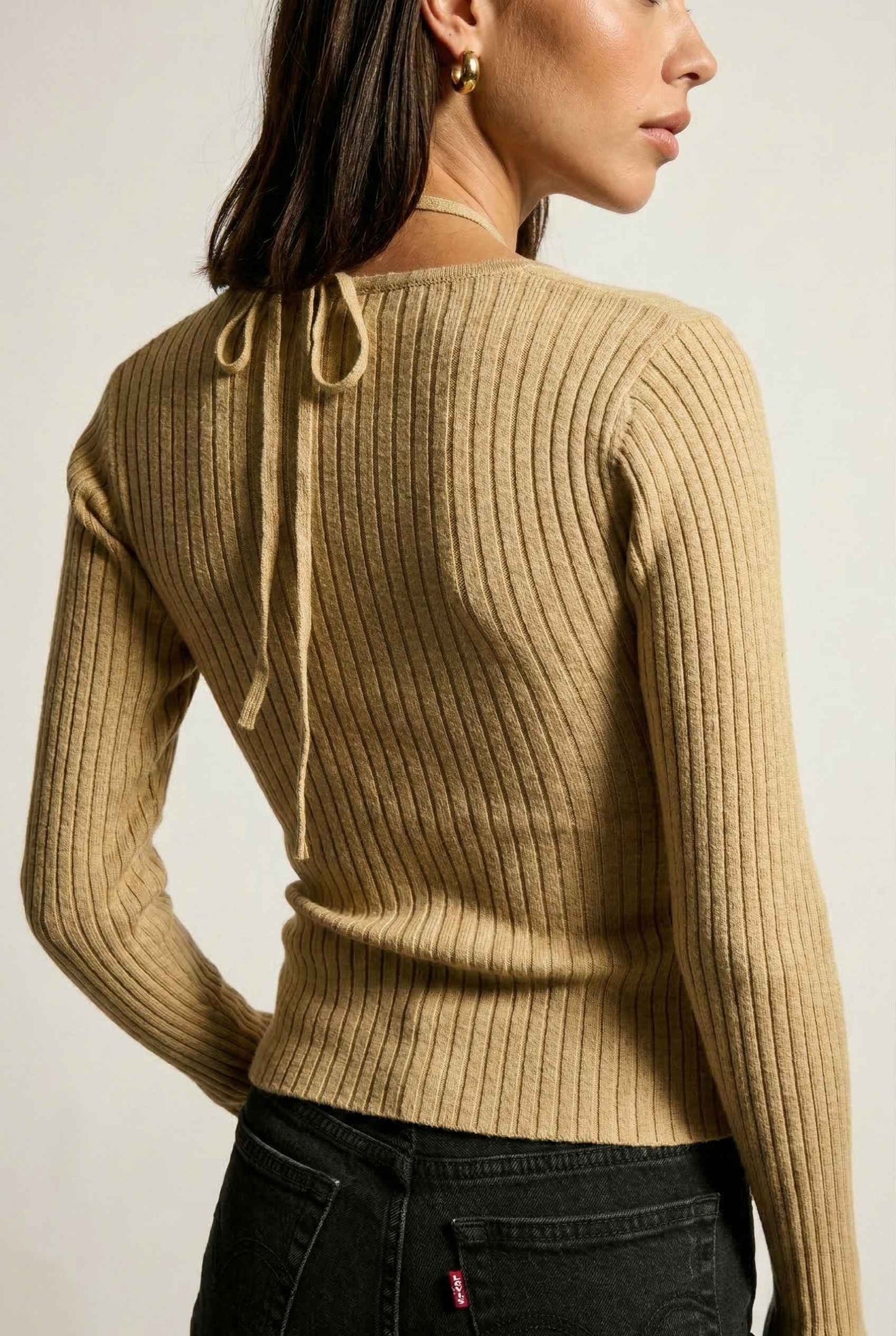 Lyra Top in Cream Beige Square Neck Ribbed Knit Top with Halter Strap Detail paired with trousers