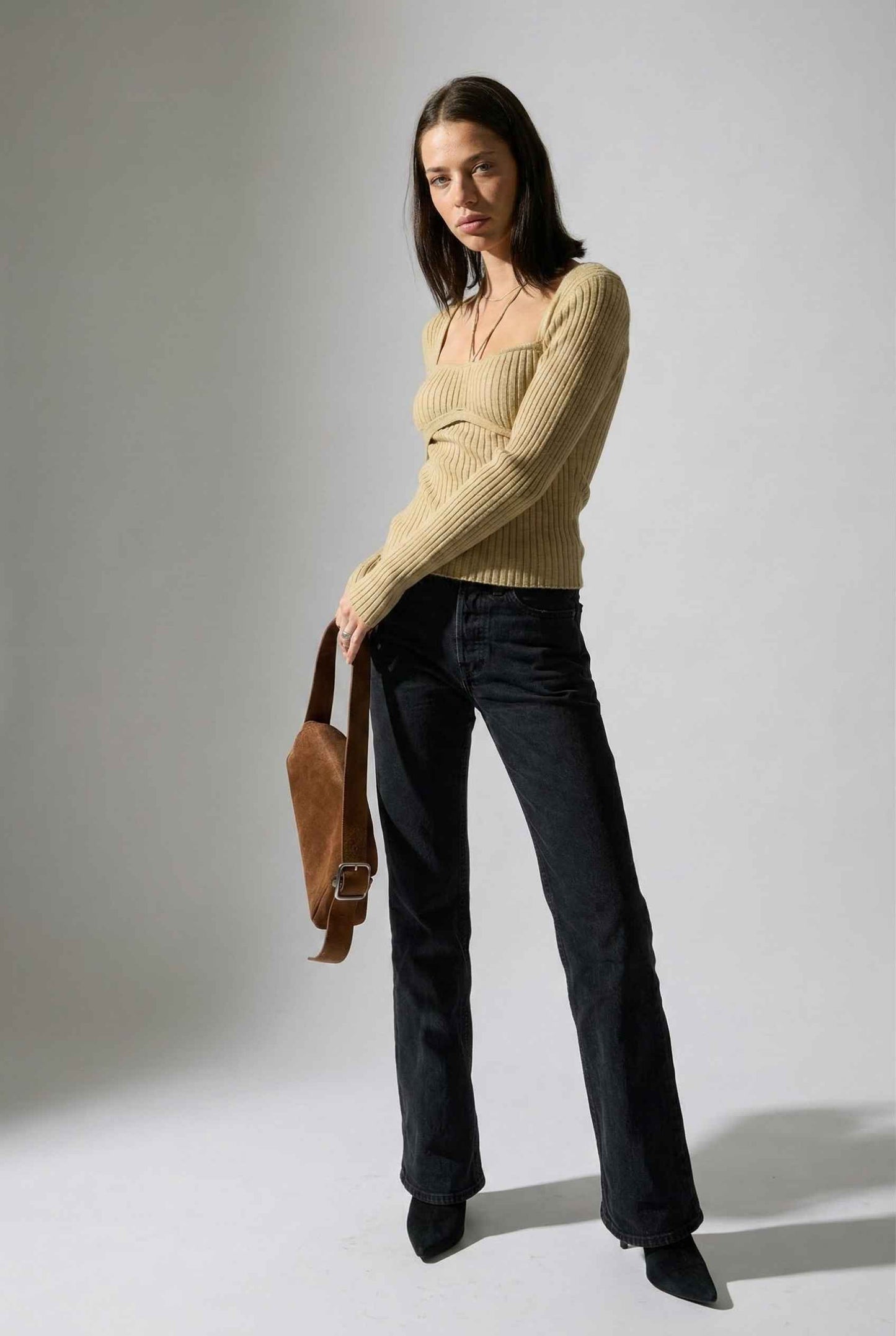 Lyra Top in Cream Beige Square Neck Ribbed Knit Top with Halter Strap Detail paired with trousers and heels
