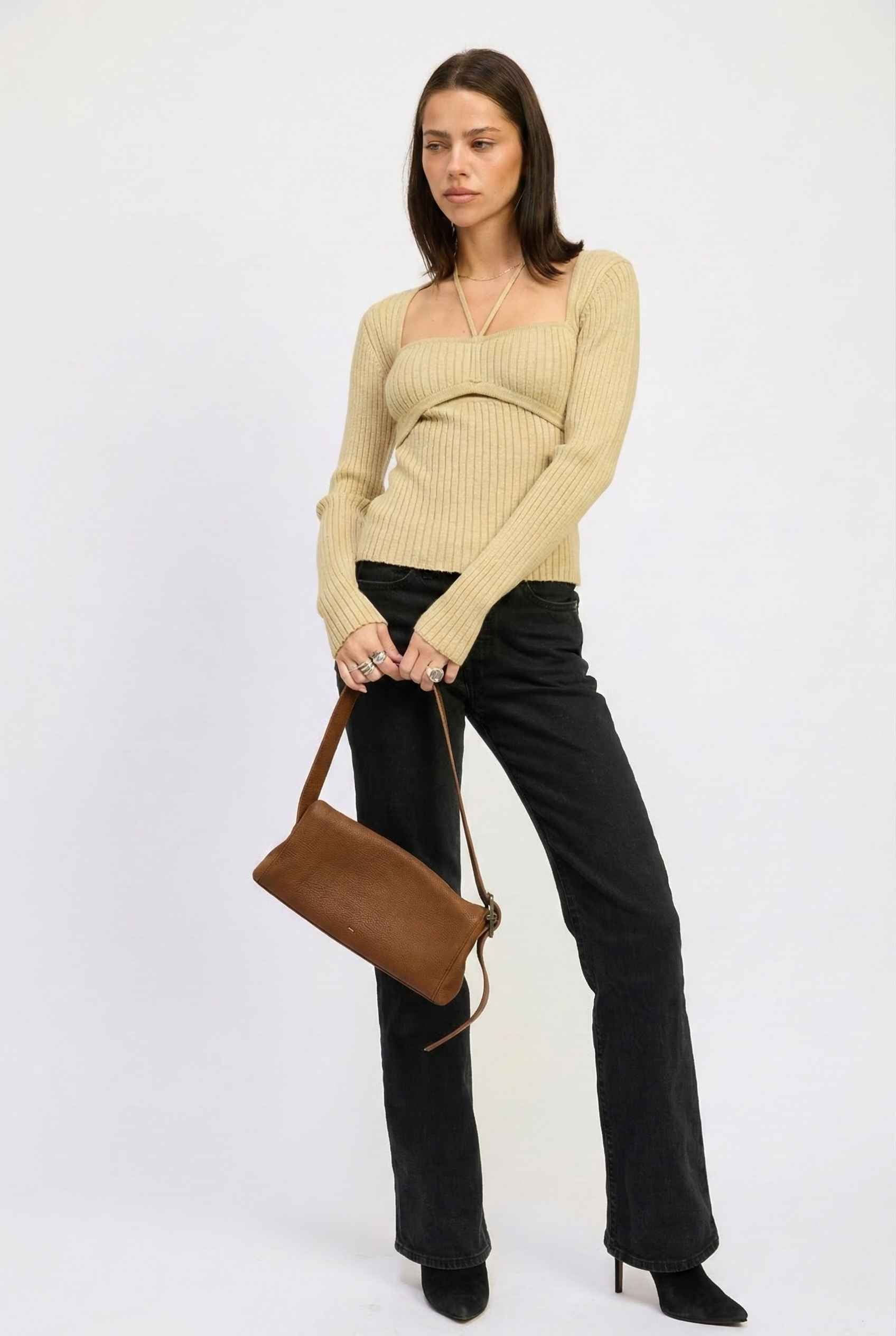 Lyra Top in Cream Beige Square Neck Ribbed Knit Top with Halter Strap Detail paired with trousers and heels