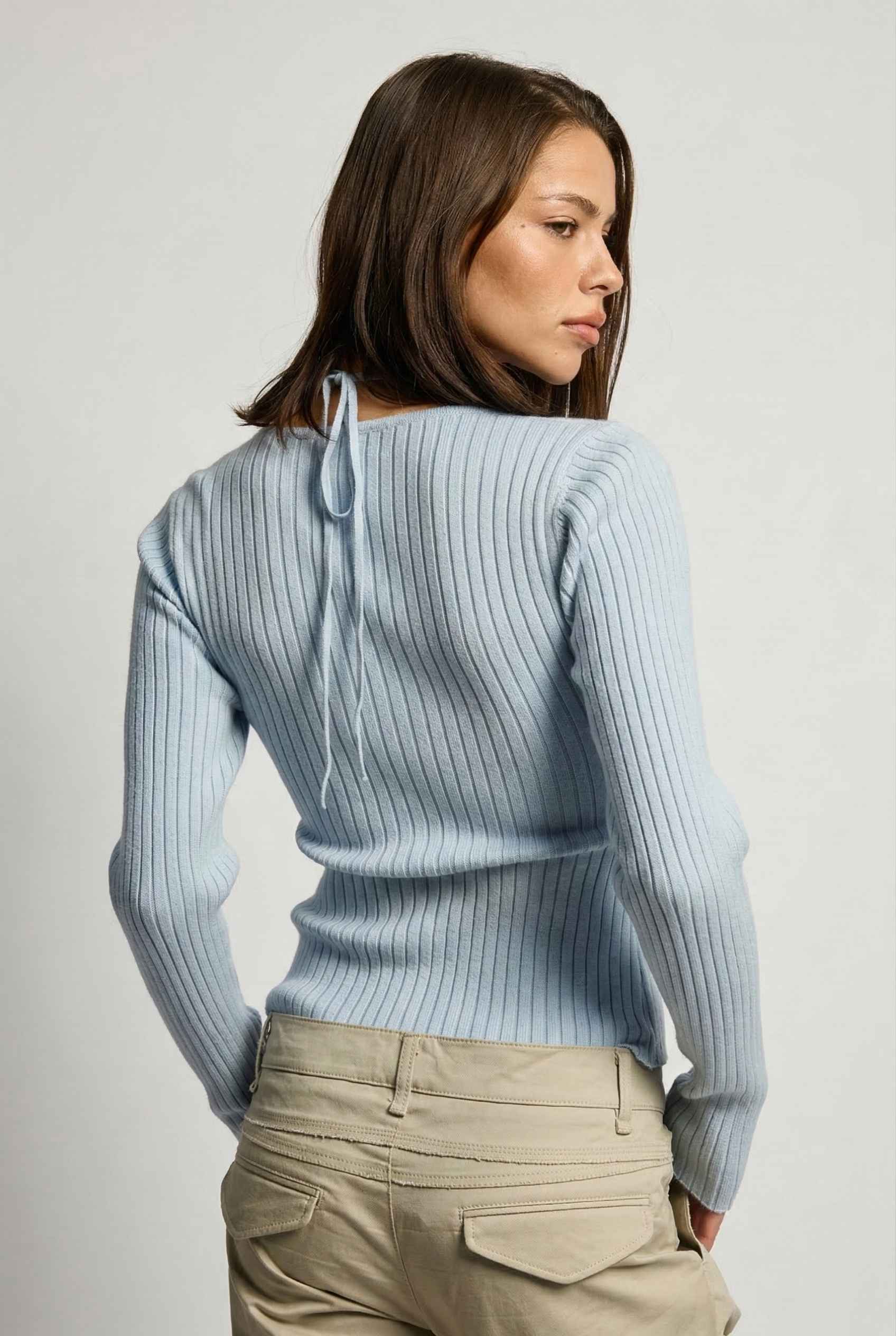 Lyra Top in Blue Square Neck Ribbed Knit Top with Halter Strap Detail paired with cargo pants 
