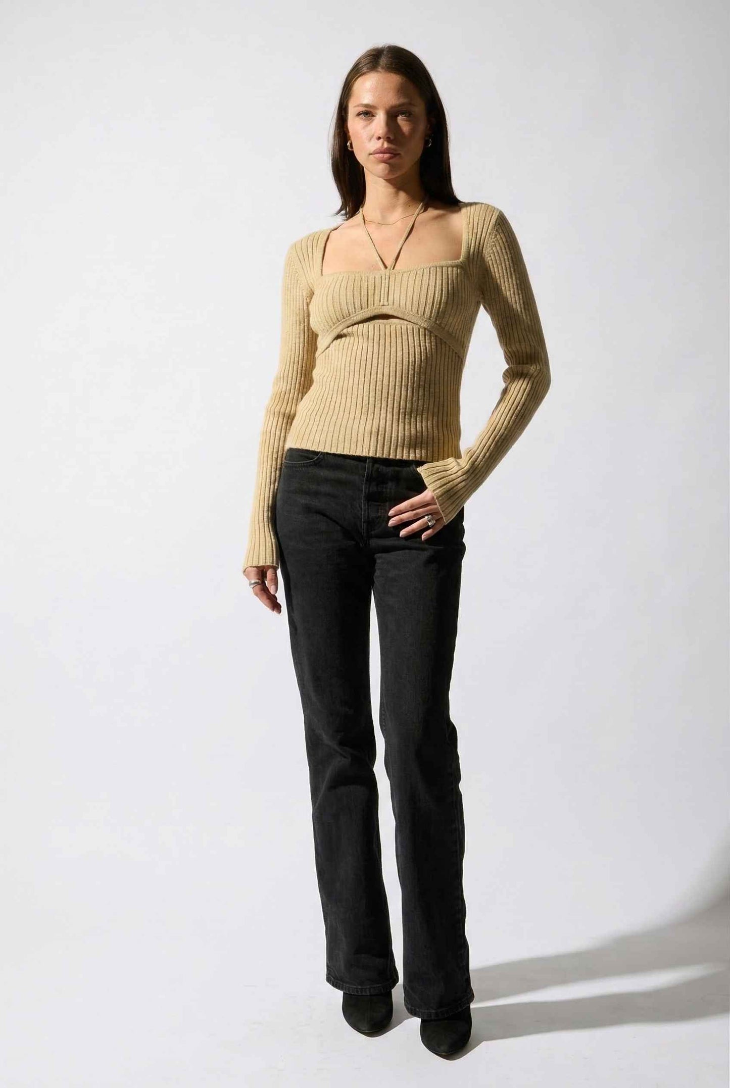 Lyra Top in Cream Beige Square Neck Ribbed Knit Top with Halter Strap Detail paired with trousers and heels