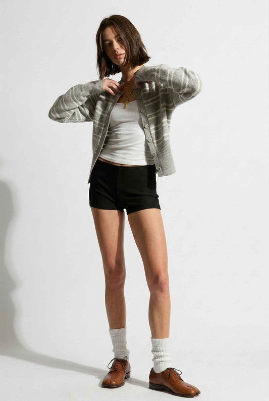 Model wearing Margot Top Striped Crew Neck Button-Up Cardigan in Grey over tank top with micro shorts, socks, and lace up loafers