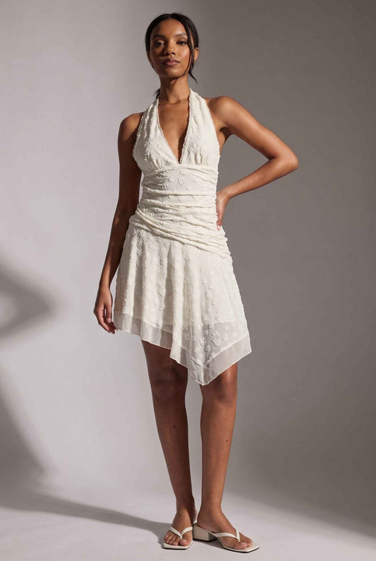 Model wearing Mikala Ruched Halter Mini Dress in Ivory Cocktail Dress paired with minimalist heels