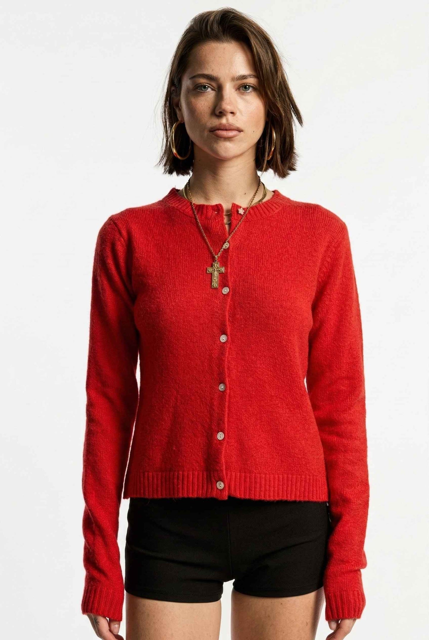 Model wearing Penelope Top in Red Soft Wool-Blend Crew Neck Button-Up Cardigan with micro shorts