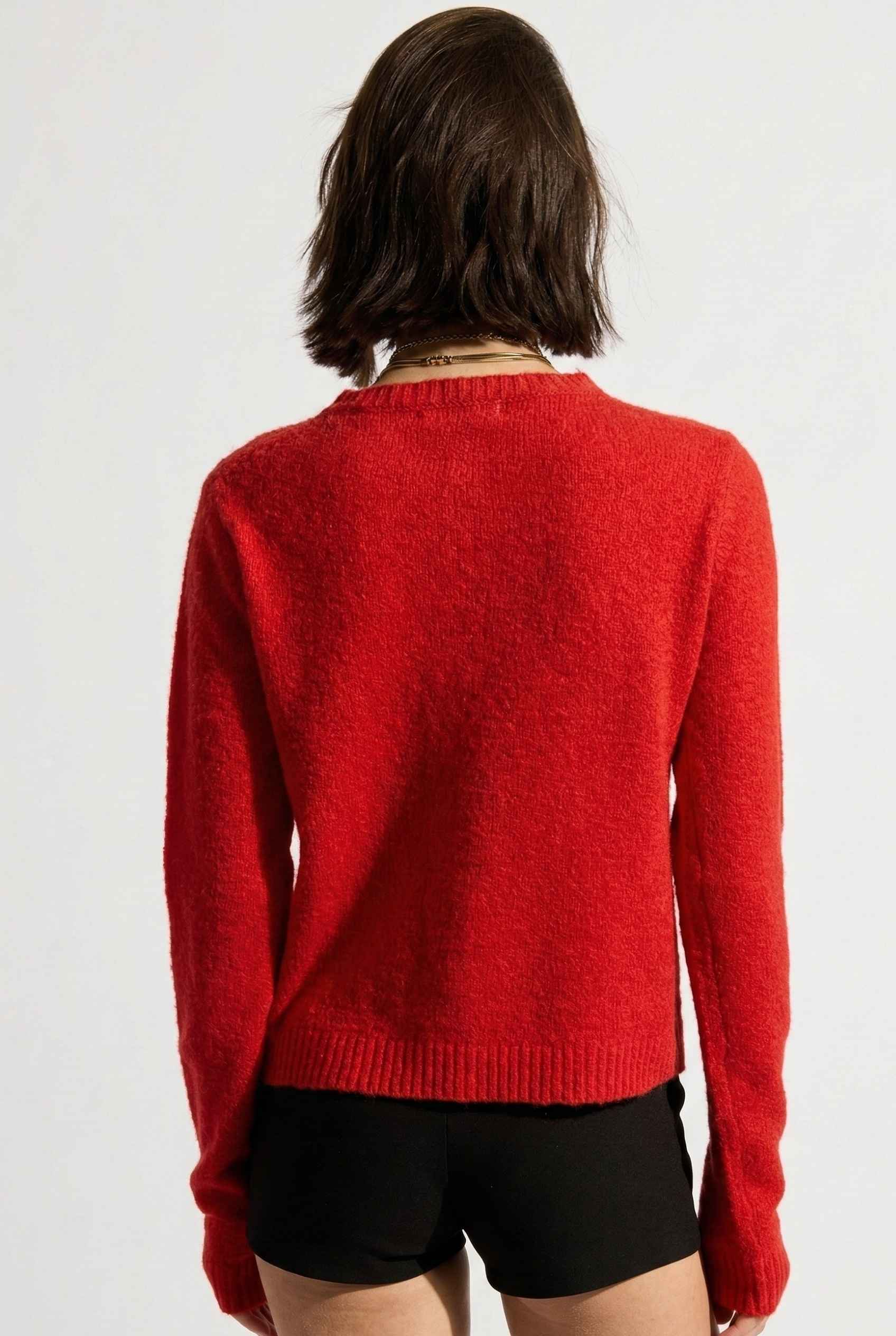 Model wearing Penelope Top in Red Soft Wool-Blend Crew Neck Button-Up Cardigan with micro shorts
