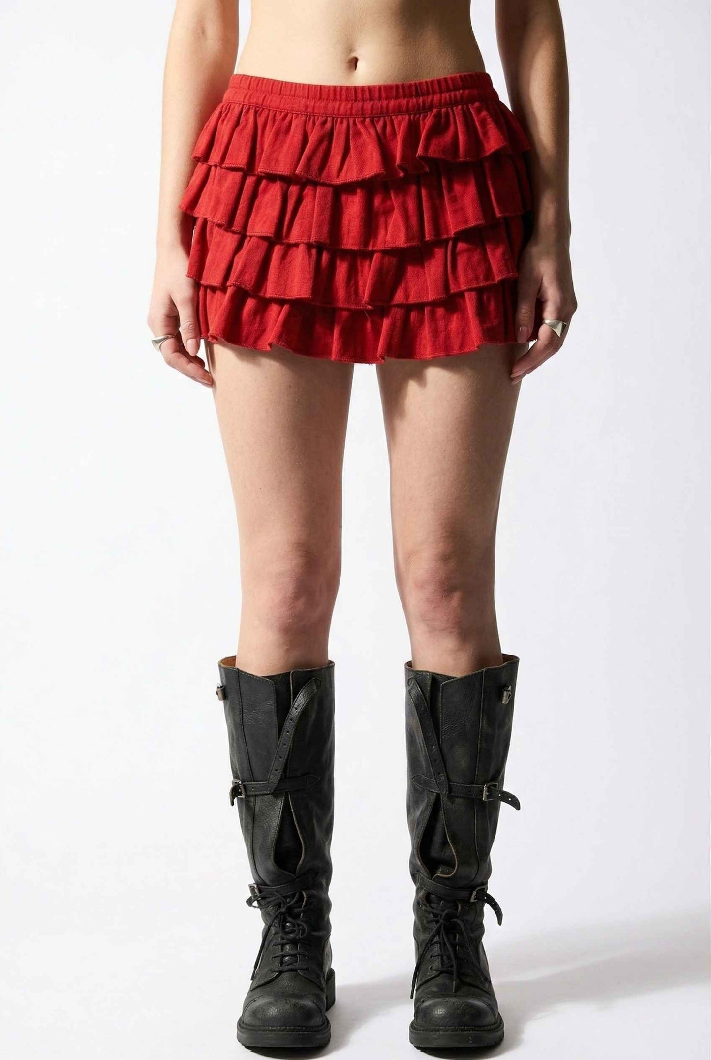 Model wearing Roxy Skirt Tiered Ruffle Ra-Ra Mini Skirt in Red with tall boots
