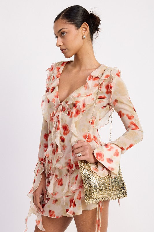 Emory Park Ruffle Trim Sheer Peplum Top in floral design worn with gold sequin purse