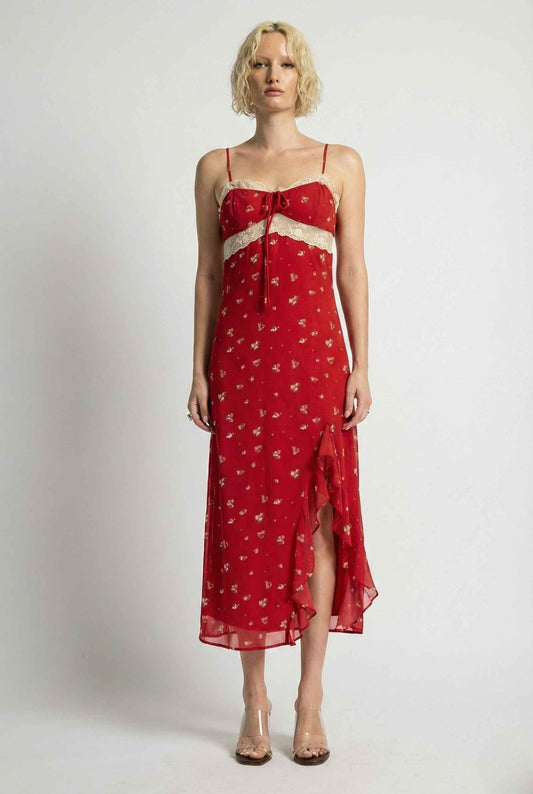 Woman wearing a Scarlett Maxi Red Floral Lace Trim Dress with a white pattern on a plain background