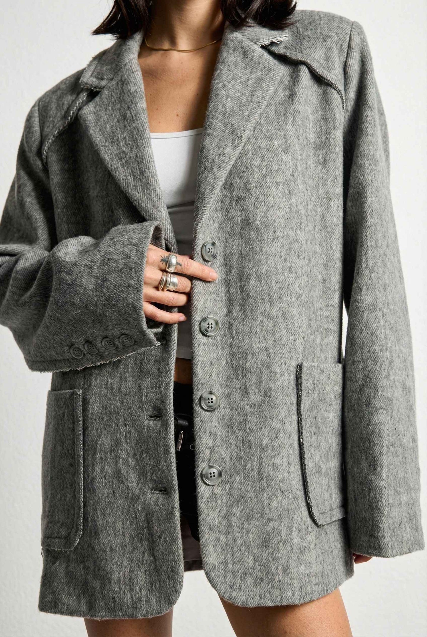 Model wearing The Silas Blazer | Grey Wool-Blend Blazer with Raw Hem Details with shorts