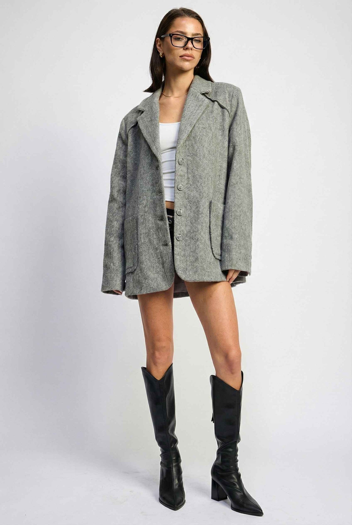 Model wearing The Silas Blazer | Grey Wool-Blend Blazer with Raw Hem Details with shorts and boots