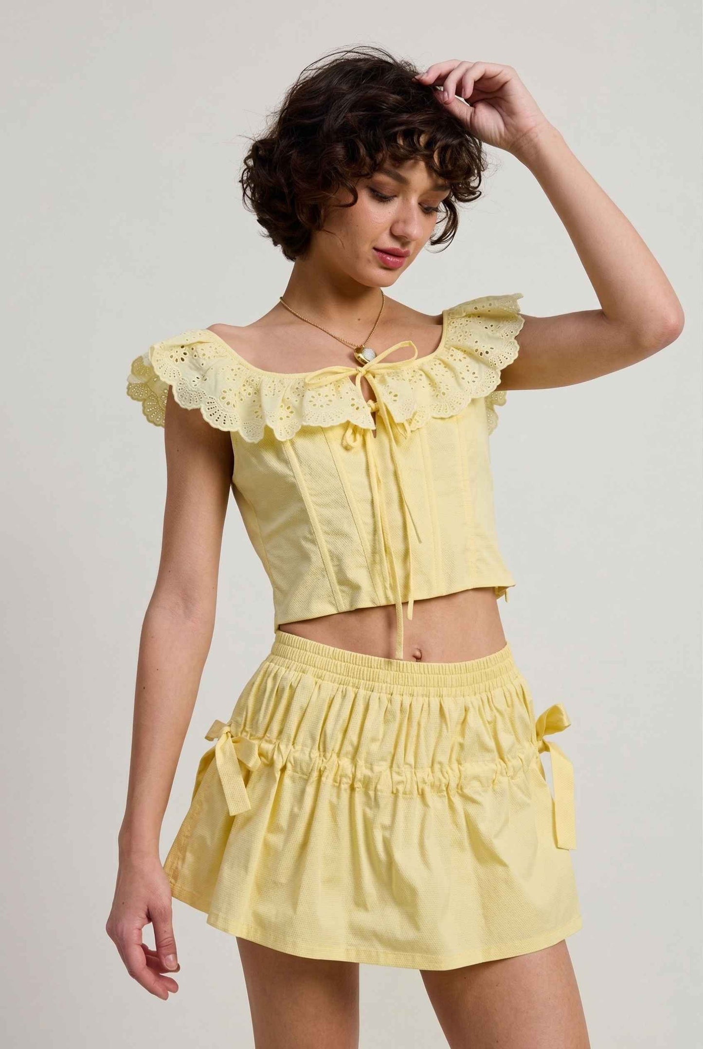 Sunnie Skirt in Soft Yellow Poplin Mini Skirt with Bows paired with matching ruffle top close bow detail