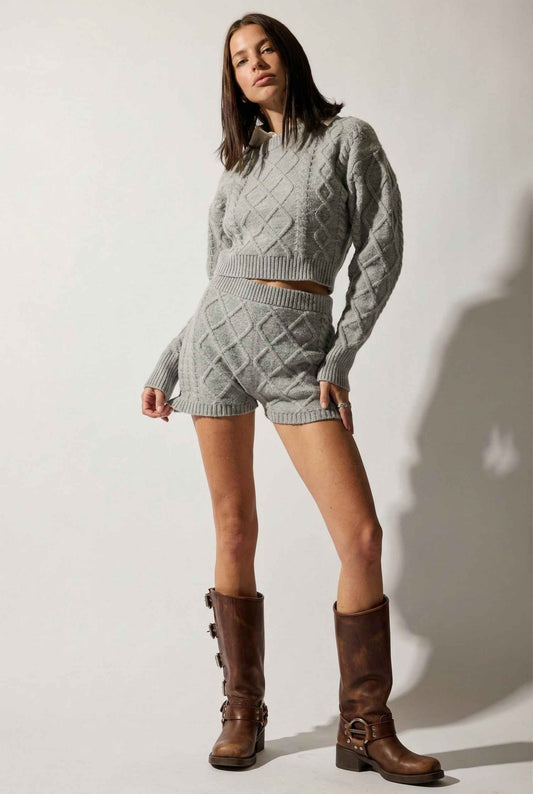 Model wearing Sutton Top in Grey Cable Knit Cropped Sweater with matching shorts and tall boots