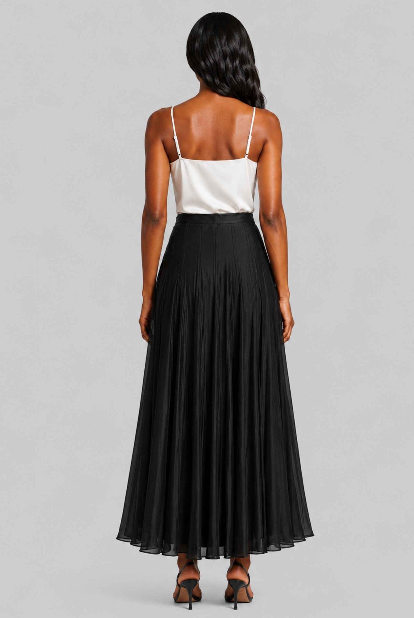 Virtual Model wearing The Astrid Pleated Skirt Lustrous Satin Black Midi Skirt