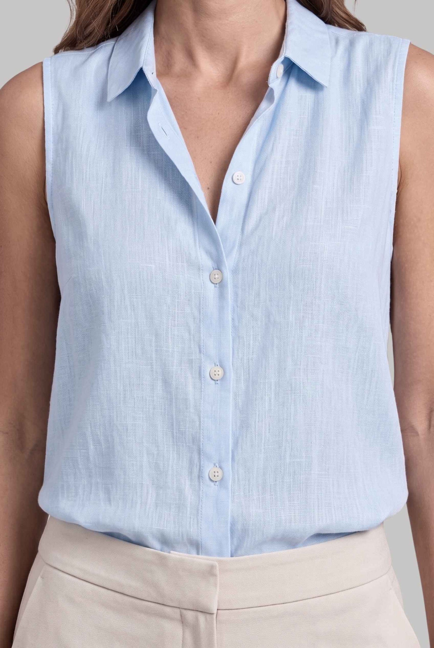 Virtual model wearing The Blair Buttoned Top sleeveless Collared Buttoned Blouse in Light Blue
