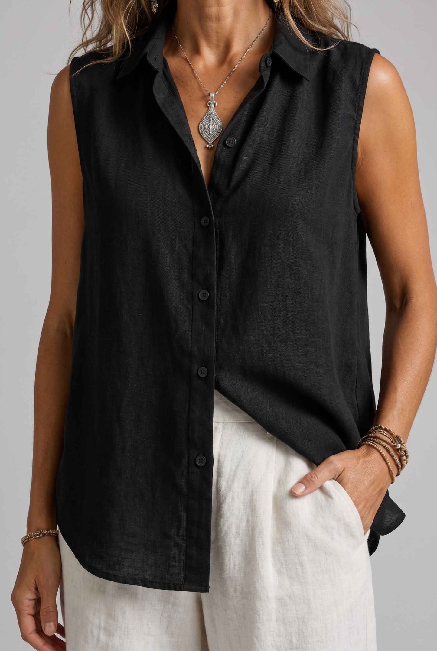 Virtual Model wearing The Blair Buttoned Top Sleeveless Black Collared Top