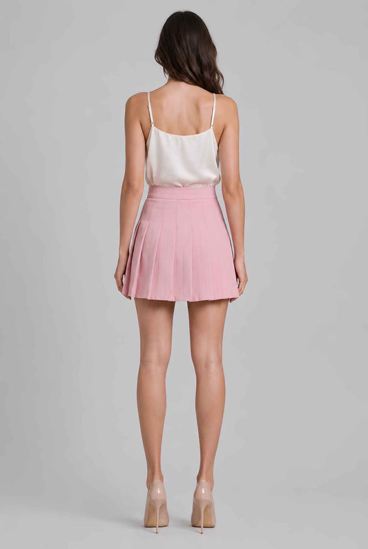 Virtual model wearing The Blythe Pleated Mini Skirt High-Waisted Pleated Tennis Mini Skirt in Pink