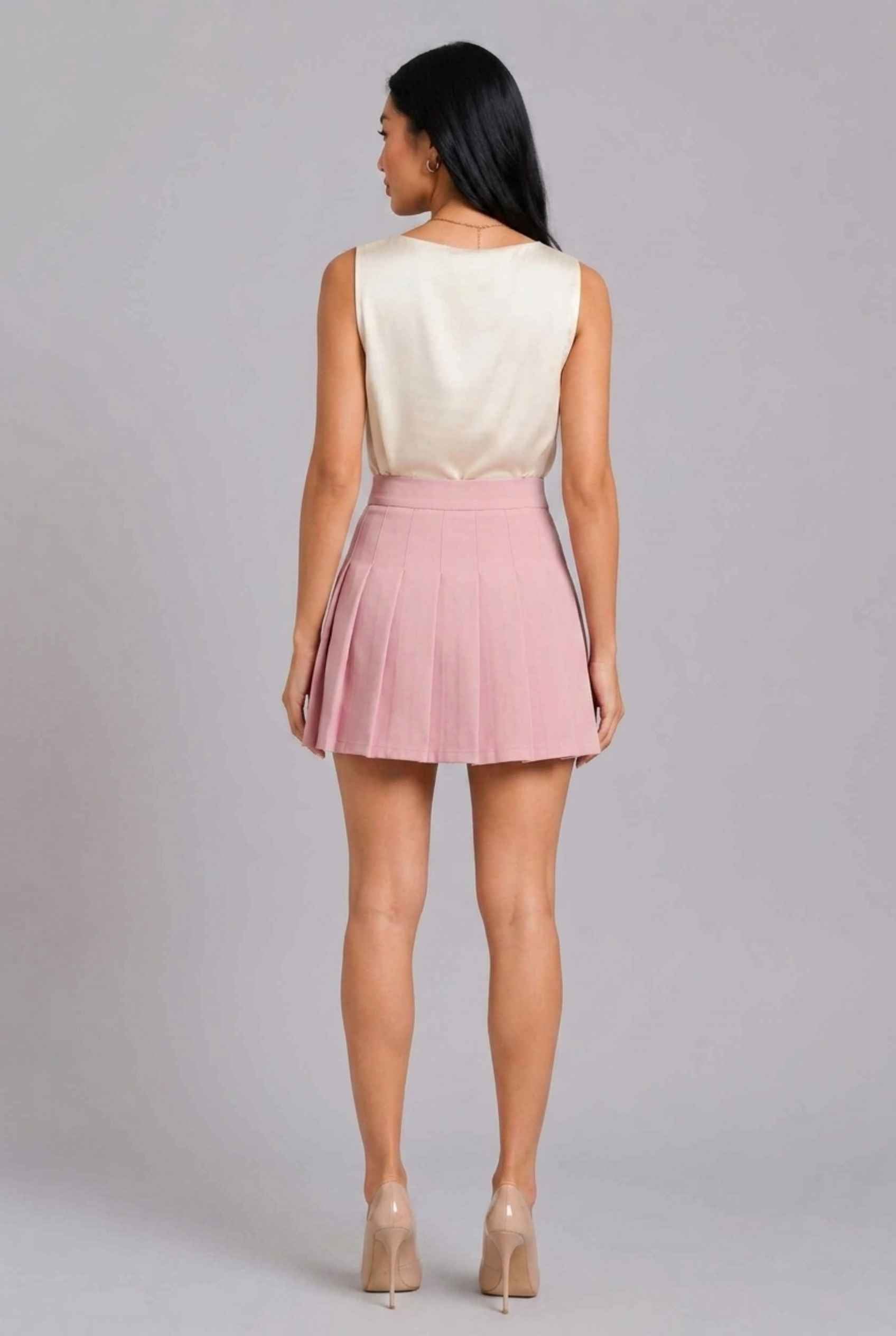 Virtual Model Wearing The Blythe Pleated Mini Skirt Pink High-Waisted Pleated Tennis Mini Skirt