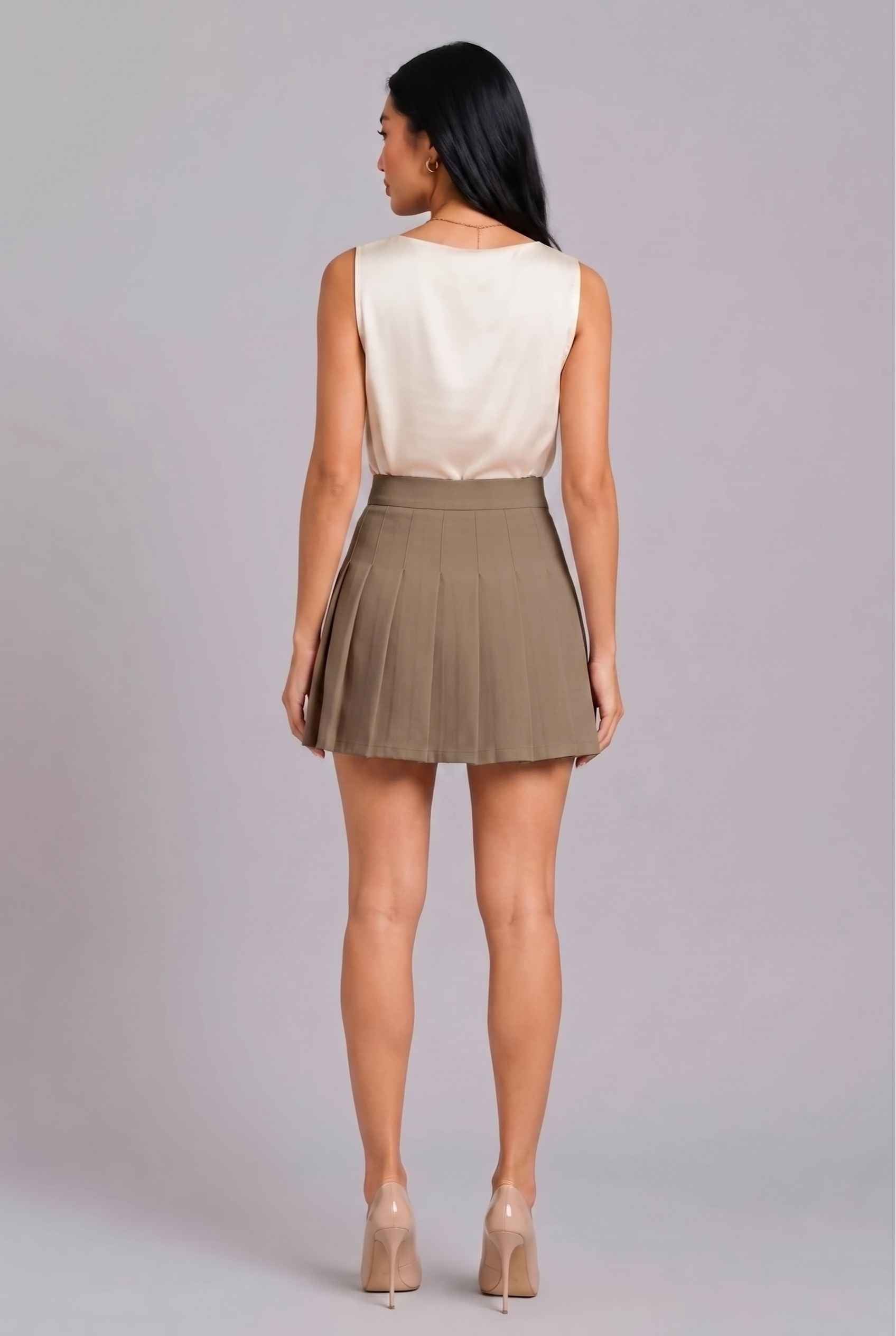 Virtual Model Wearing The Blythe Pleated Mini Skirt Taupe High-Waisted Pleated Tennis Mini Skirt