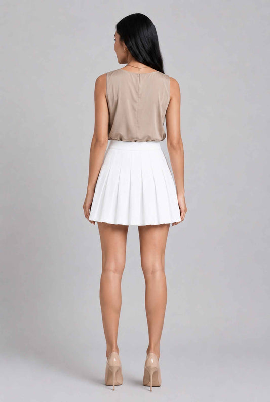 Virtual model wearing The Blythe Pleated Mini Skirt High-Waisted Pleated Tennis Mini Skirt in White