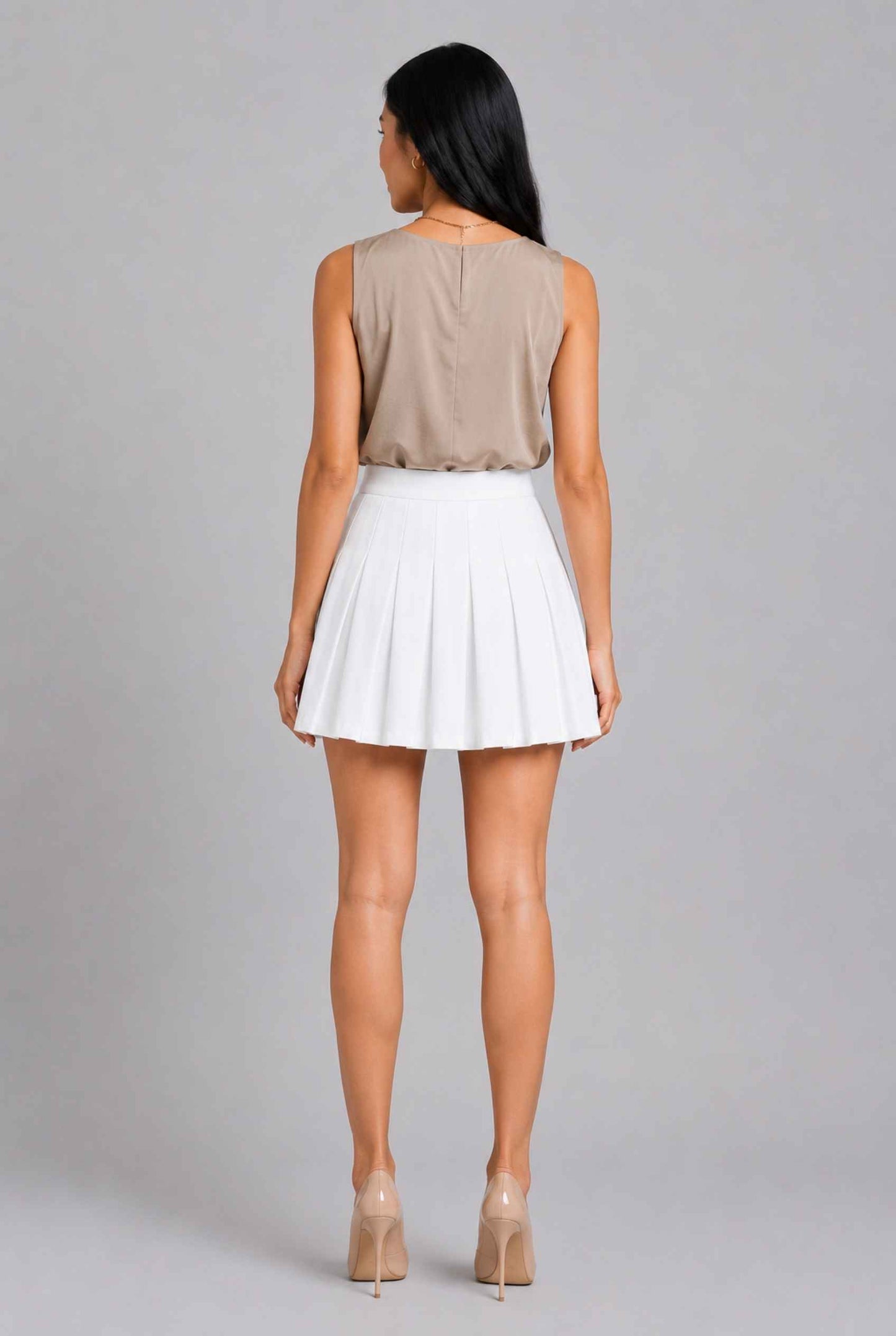 Virtual Model Wearing The Blythe Pleated Mini Skirt White High-Waisted Pleated Tennis Mini Skirt