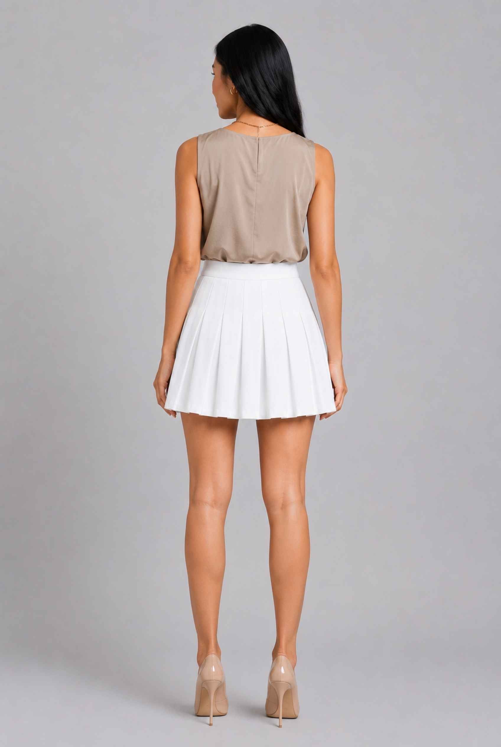 Virtual Model Wearing The Blythe Pleated Mini Skirt White High-Waisted Pleated Tennis Mini Skirt