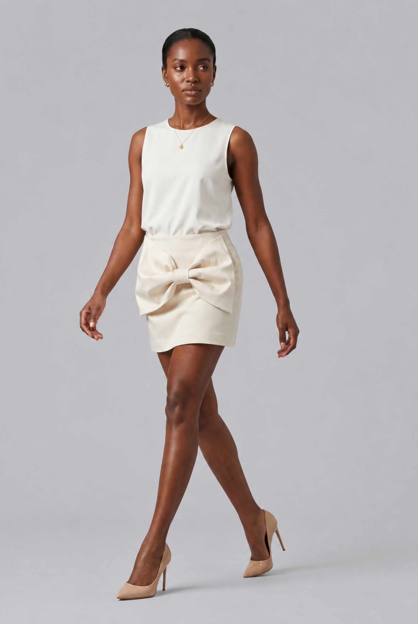 Virtual Model wearing The Cordelia Bow Skirt Taffeta Cream Mini Skirt