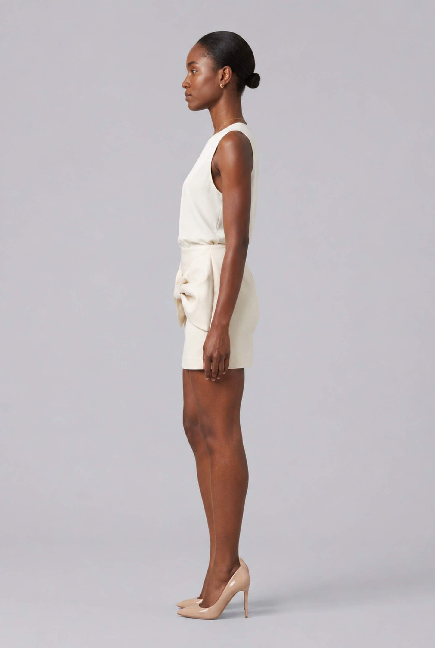 Virtual Model wearing The Cordelia Bow Skirt Taffeta Cream Mini Skirt