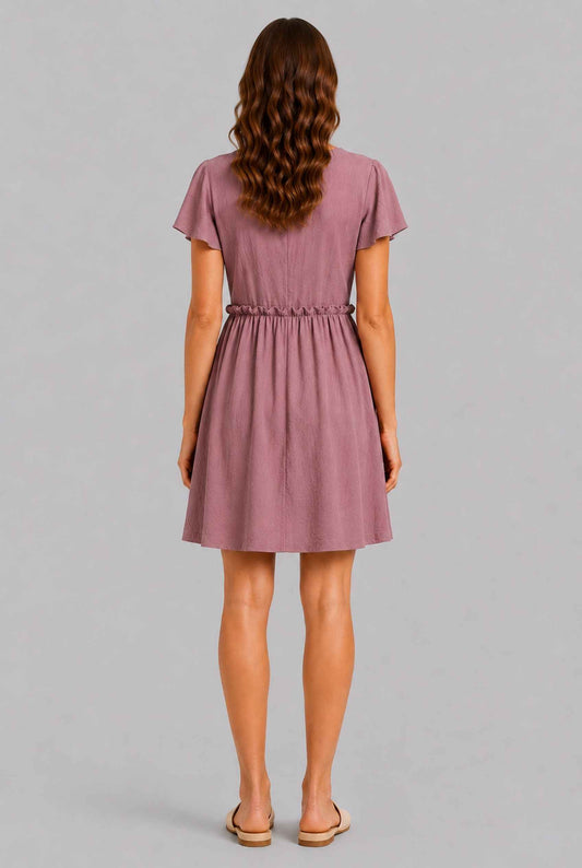 Virtual Model wearing The Delia Buttoned Mini Blush Flutter Sleeve Ruffled Dress