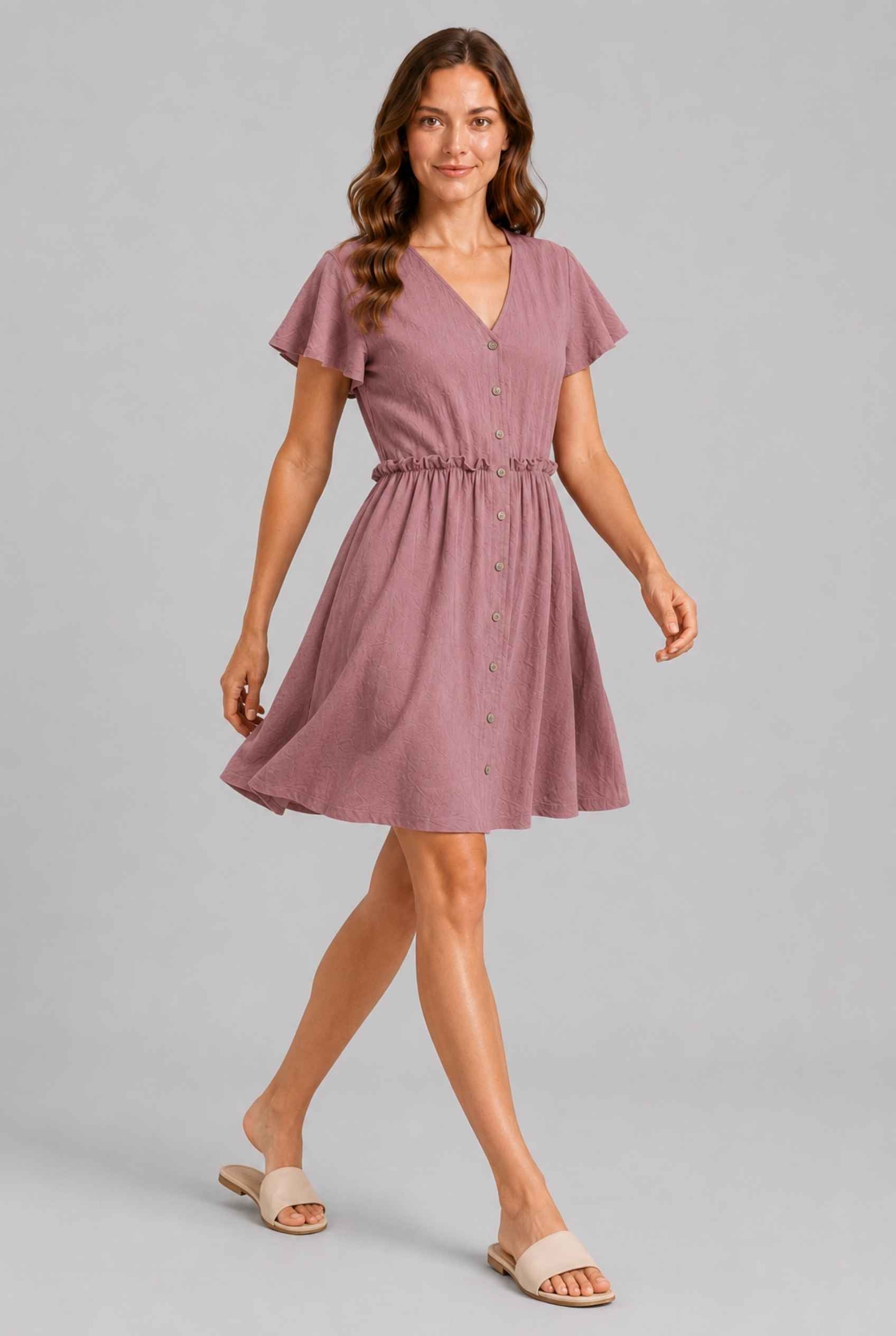 Virtual Model wearing The Delia Buttoned Mini Blush Flutter Sleeve Ruffled Dress