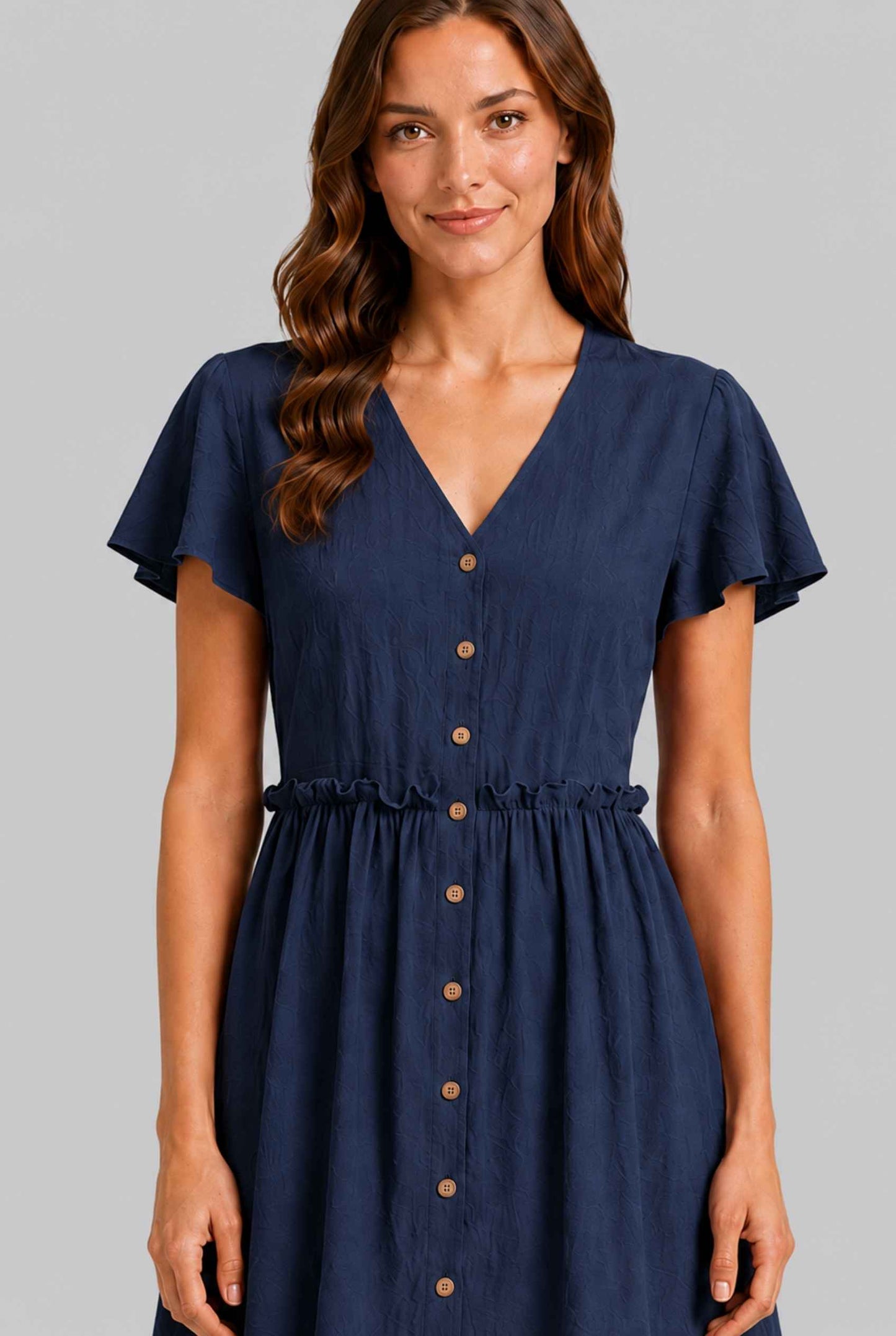 Virtual Model wearing The Delia Buttoned Mini Navy Flutter Sleeve Ruffled Dress