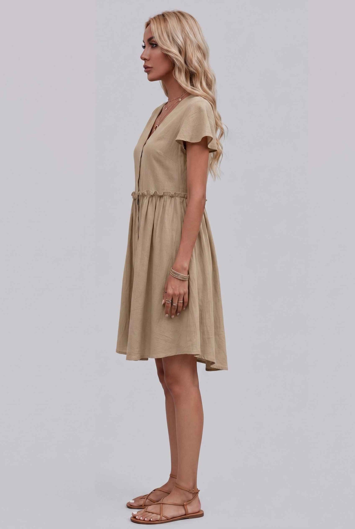 Virtual Model Wearing The Delia Buttoned Mini Flutter Sleeve Ruffled Beige Dress