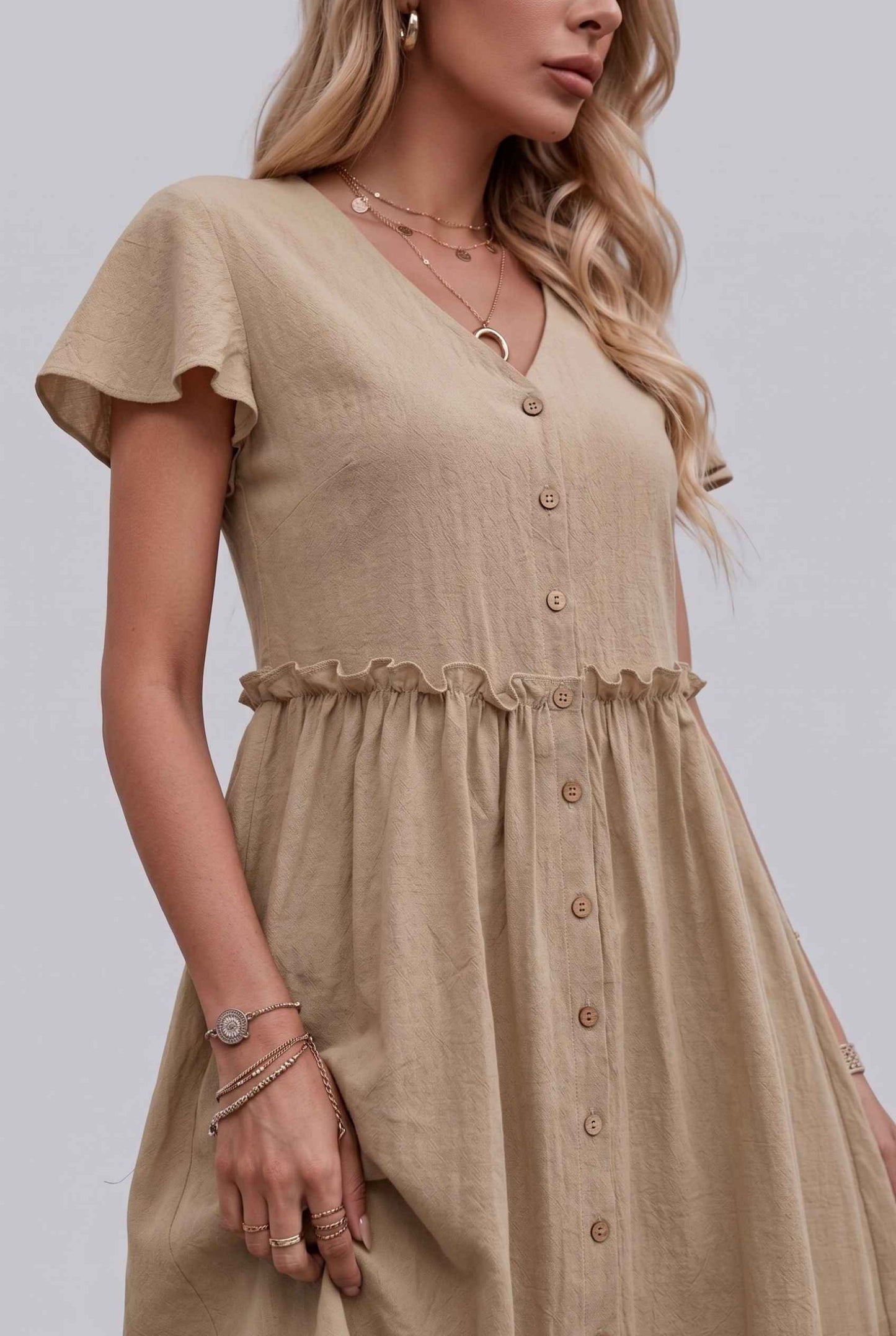 Virtual Model Wearing The Delia Buttoned Mini Flutter Sleeve Ruffled Beige Dress